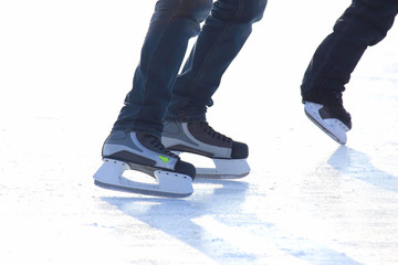 Feet skating on the ice rink