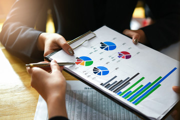 Close up Business People Analyzing Statistics Business Documents, Financial Concept