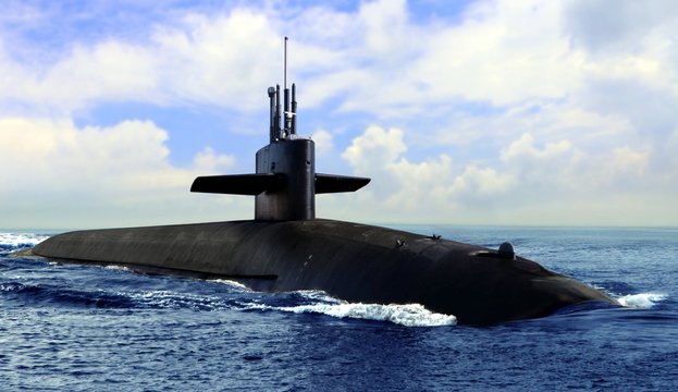 Naval submarine on open blue sea surface