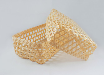 beautiful natural wicker basket,  isolated bamboo basket set on white background, natural packaging design by weaved bamboo, opening of handmade slight packaging on white background