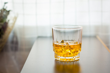 glass of whisky on the table background