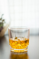 glass of whisky on the table background
