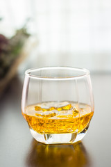 glass of whisky on the table background