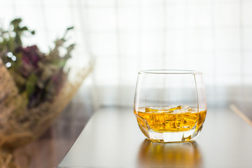 glass of whisky on the table background