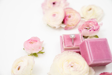 Ranunculus and Anemone Flower Background with Wedding Ring in Velvet box