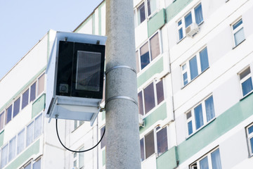 Concrete support with installed photo-speed of vehicles close-up. In the background-a fragment of a...