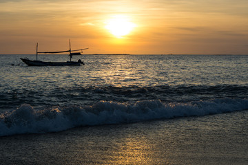 Sunset view on the beach of Jimbaran in Bali, Indonesia