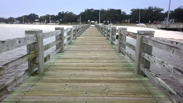 A personal perspective walking on the I-110 Loop boardwalk on the shoreline in Biloxi, Mississippi.  	