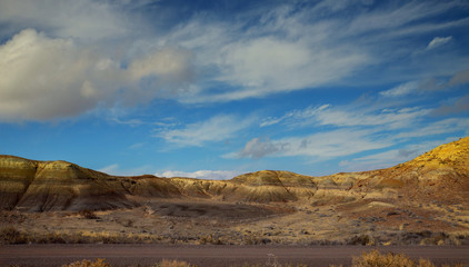 Fototapeta na wymiar Clouds over New Mexico Red Rock Landscape, Southwest USA