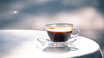 hot cup of black coffee on table