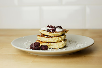 Tasty curd cheesecakes with coconut chips and blueberries. The most beautiful breakfasts for lovers