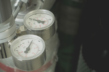 Pressure Gauge, pressure gauge on a gas regulator in a laboratory analytical equipment.
