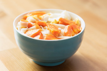 A bowl of  homemade carrot noodles. Vegetarian diet. 