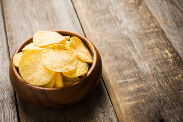 Salty chips on the rustic background. Selective focus. Shallow depth of field.