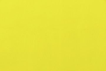 Abstract background from yellow concrete wall. Free space for text.