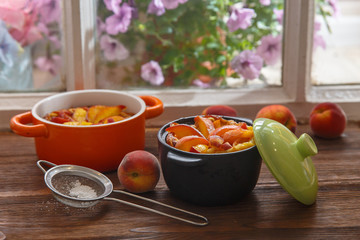 Delicious pudding with peach in casserole, closeup