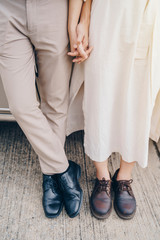 Closeup of loving couple holding hands on road trip at sunset. Love, Valentine and wedding concept.