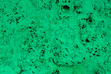 green porous volcanic stone close up. rough natural texture surface