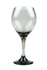 Empty smoked grey wine glass over a white background