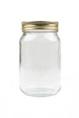 Empty glass canning jar over a white background