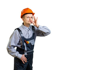 The builder and working engineer shows with a hand gesture that your repair will be done in the best possible way. isolated