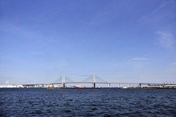 Fototapeta na wymiar Yokohama Bay Bridge, Kanagawa Prefecture, Japan. It is a symbol of Yokohama Port entrance, which is also a port liner.