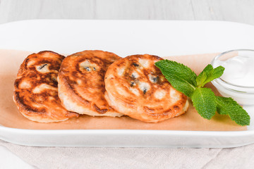 Fried Russian curd fritter pancakes on a plate