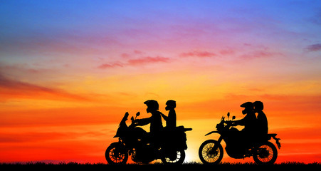 Fototapeta premium silhouette of lover couple in sunset with classic motorcycle