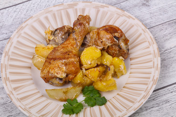 Roasted chicken legs with potato