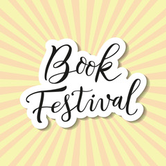 Modern calligraphy lettering of Book Festival in black with white outline and shadow in paper cut style on background with rays for banner, poster, advertising, book festival, sale, book store, shop