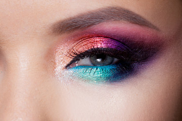 Obraz premium Bright eye makeup. Pink and blue color, colored eyeshadow.