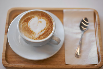 Hot mocha coffee or capuchino with heart pattern