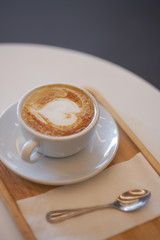 Hot mocha coffee or capuchino with heart pattern