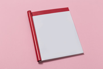 Mock-up magazine or catalog on pink background.