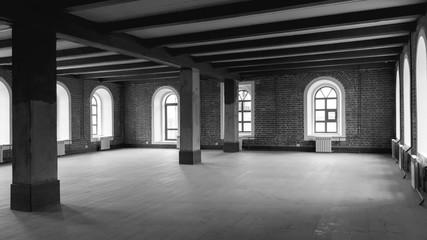 Loft studio Interior in old house. Big windows, brick red wall. Renovation architecture concept