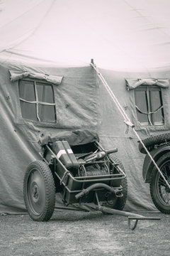 Auxiliary Wehrmacht infantry carriage is located at the military tent on a black and white photograph.