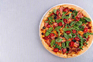 Fresh pizza on restaurant table