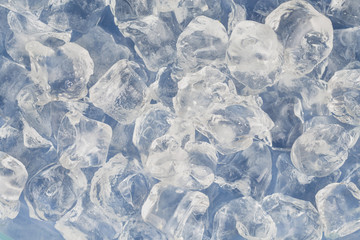 Frozen ice cubes for cocktails. Background with ice cubes. Top view.