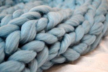 Hand Dyed Merino Wool. Close-up of knitted blanket, merino wool background