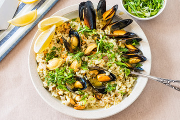 Lemon rice with mussels, midopilafo in a plate, top view - greek dish