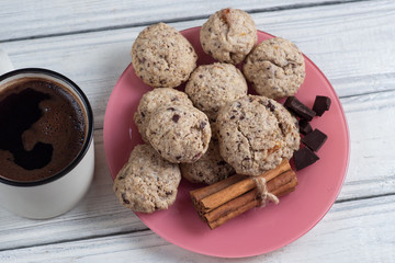 coffee mug and homemade cookies with dried fruits, nuts and cereals