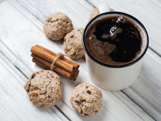 A Cup of coffee and homemade cookies on a wooden table. healthy and tasty Breakfast