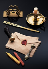 Old envelopes with red wax seal, letter opener and letter holder. Vintage writing accessories