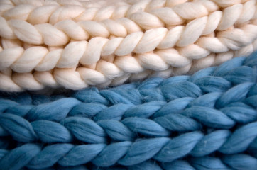 Fototapeta na wymiar Knit from Merino wool. Blue with white