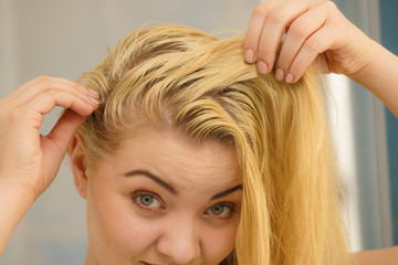 Naklejka premium Female having problem with blonde hair
