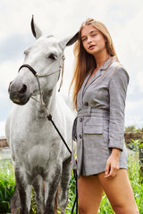 Stunning young woman with pony, portrait