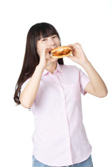 Chinese American woman eating Chicken Sandwich isolated on white background