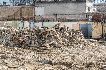 Damaged broken house, Remains of hurricane or earthquake aftermath disaster damage on ruined old houses with collapsed roof and wall 