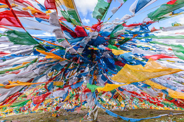 Colorful prayer flags at the Mila Mountain Pass (between the Lhasa Prefecture and the Nyingchi...