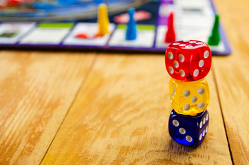 board game with multi-colored cubes on a wooden background